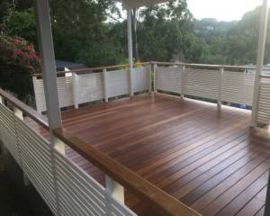 Covered Timber Deck With Painted Handrails